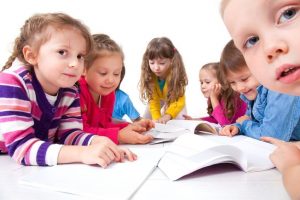 16035996 - group of children enjoying reading together